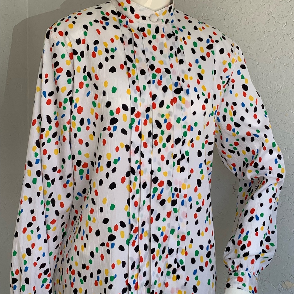 Vintage white background, multicolored long sleeve blouse
